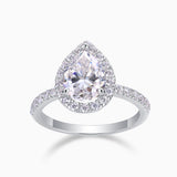 Pear-cut halo engagement ring in white gold vermeil with round micro-pavé border