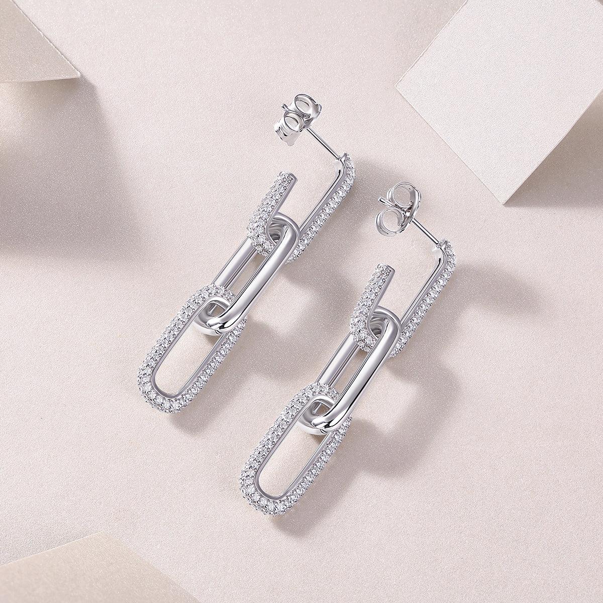 Pair of pavé bar paperclip link drop earrings, oval frames with shimmering pavé