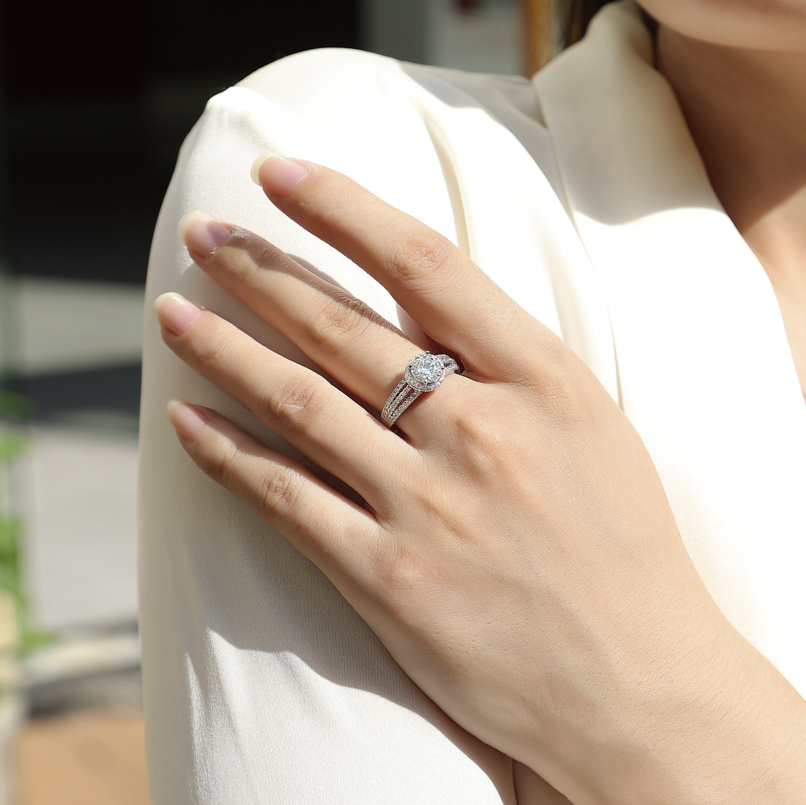 Moissanite halo ring on hand with pavé split shank, white gold vermeil