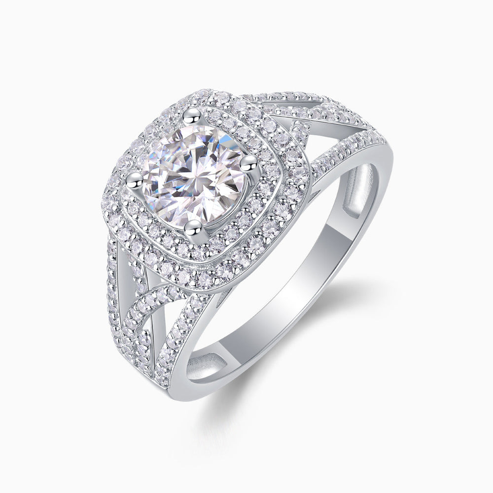 Angled view of moissanite cushion halo engagement ring in white gold-plated metal