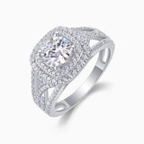 Angled view of moissanite cushion halo engagement ring in white gold-plated metal