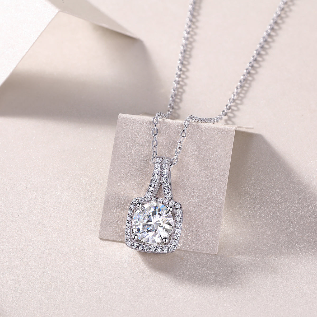 Cushion halo moissanite pendant with prong-set center stone and pavé border, white gold