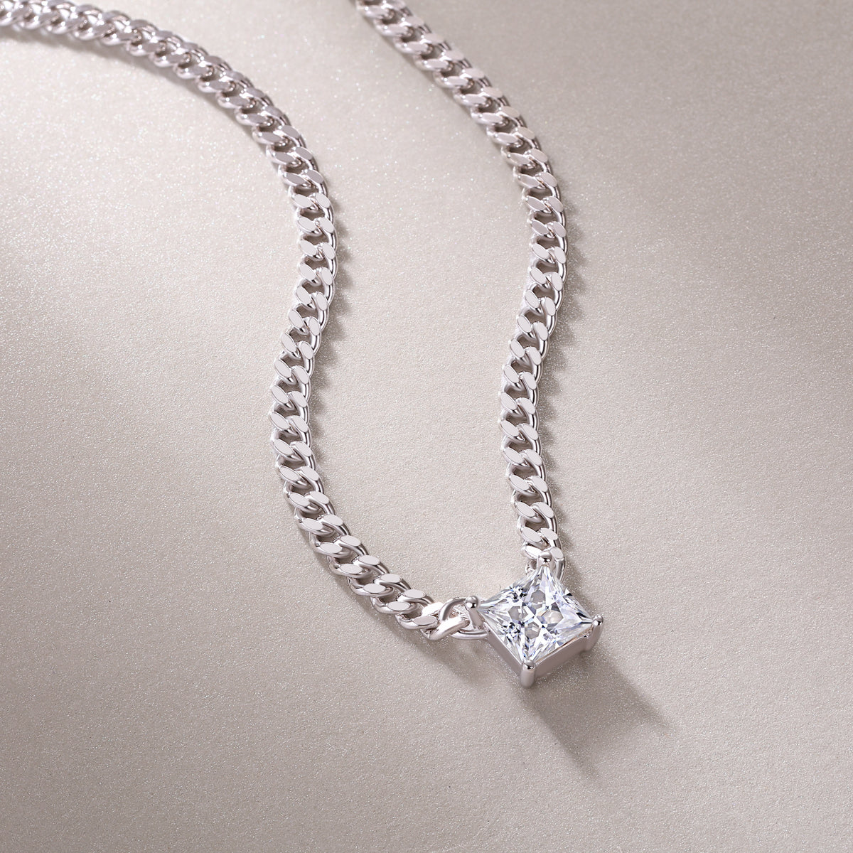 Square princess-cut moissanite pendant on Cuban link chain, white-toned finish