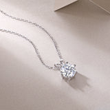 Round moissanite pendant in 6-prong crown setting on chain, white gold vermeil