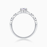 Oval moissanite ring top view with prong-set center stone and chain-link band