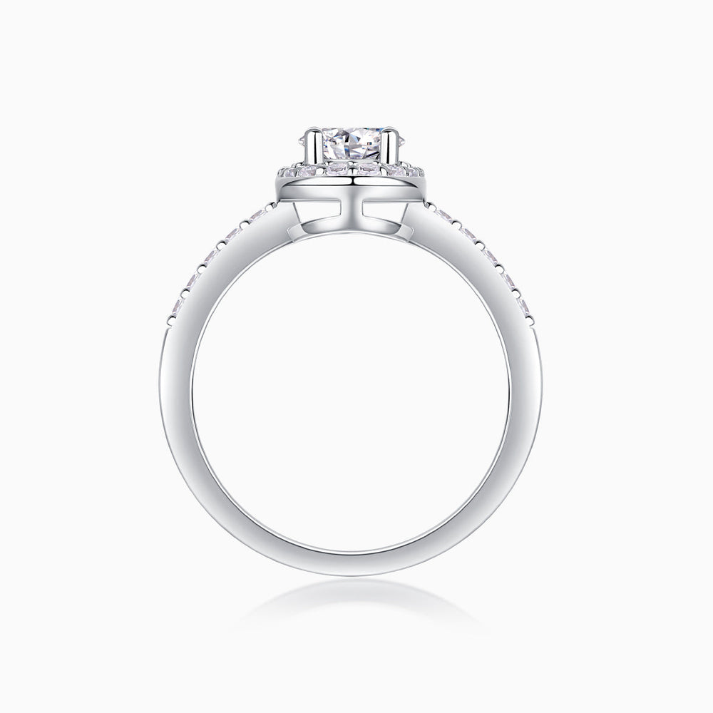 Top view of oval Moissanite engagement ring setting, pavé band, white gold vermeil