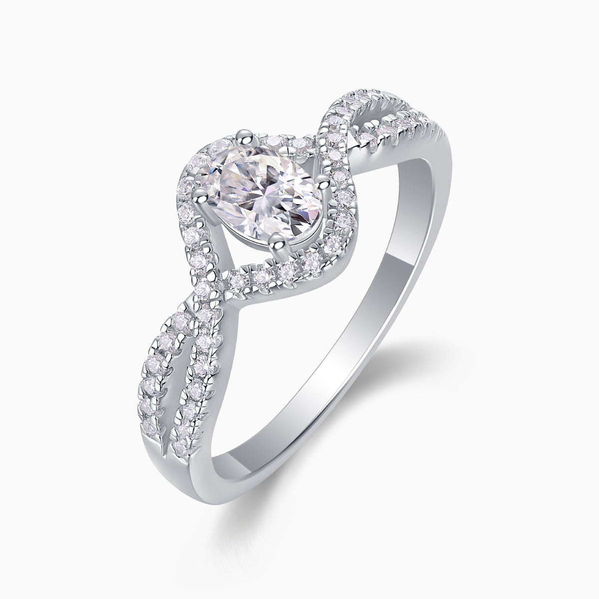Oval moissanite center with pavé halo and twisted band detail, white gold vermeil