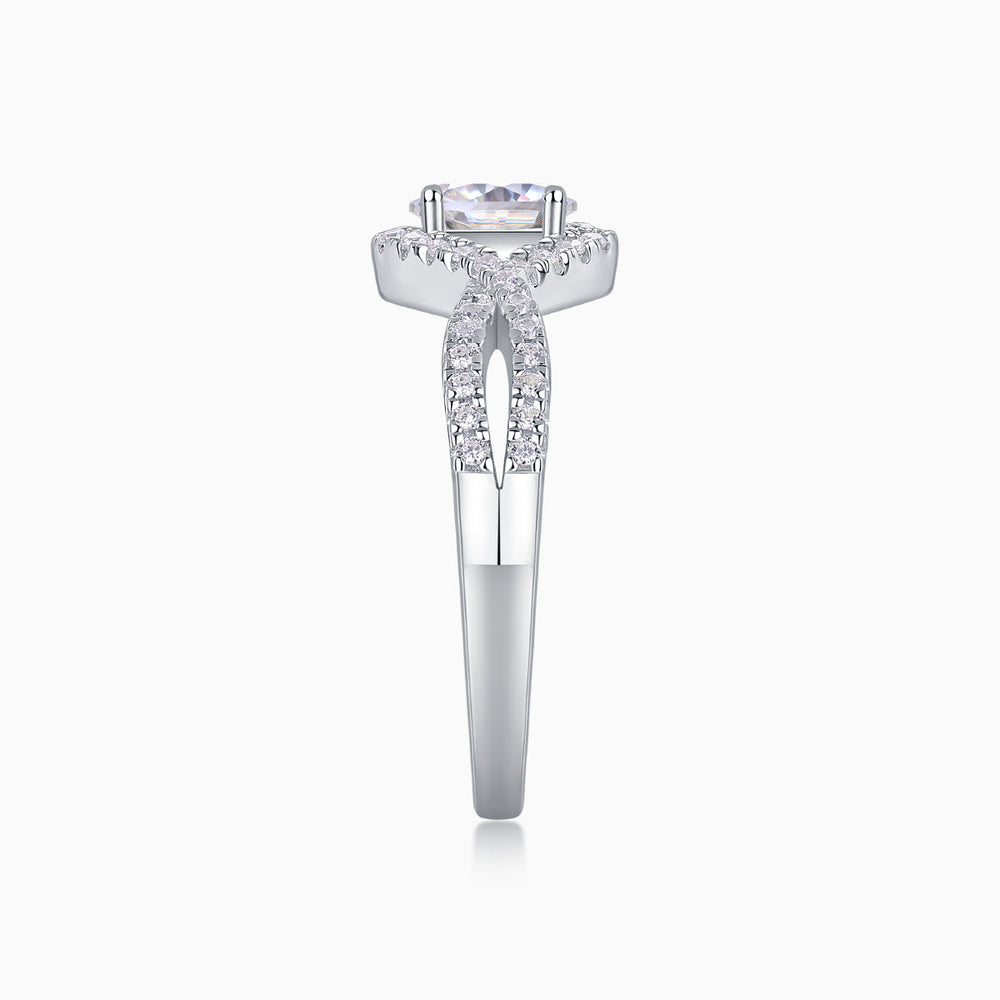 Top view of oval halo moissanite engagement ring with pavé accents, white gold vermeil