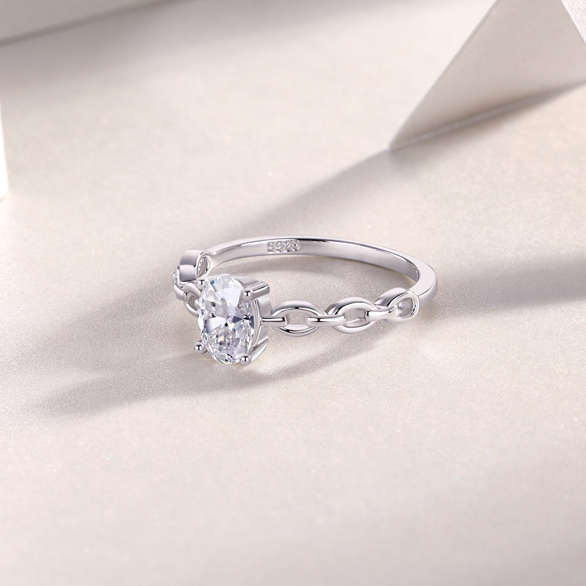 Oval moissanite chain link band ring side view, linked band and oval center stone