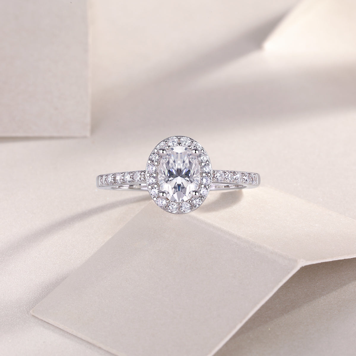 Oval Moissanite pavé engagement ring with straight band, white gold vermeil