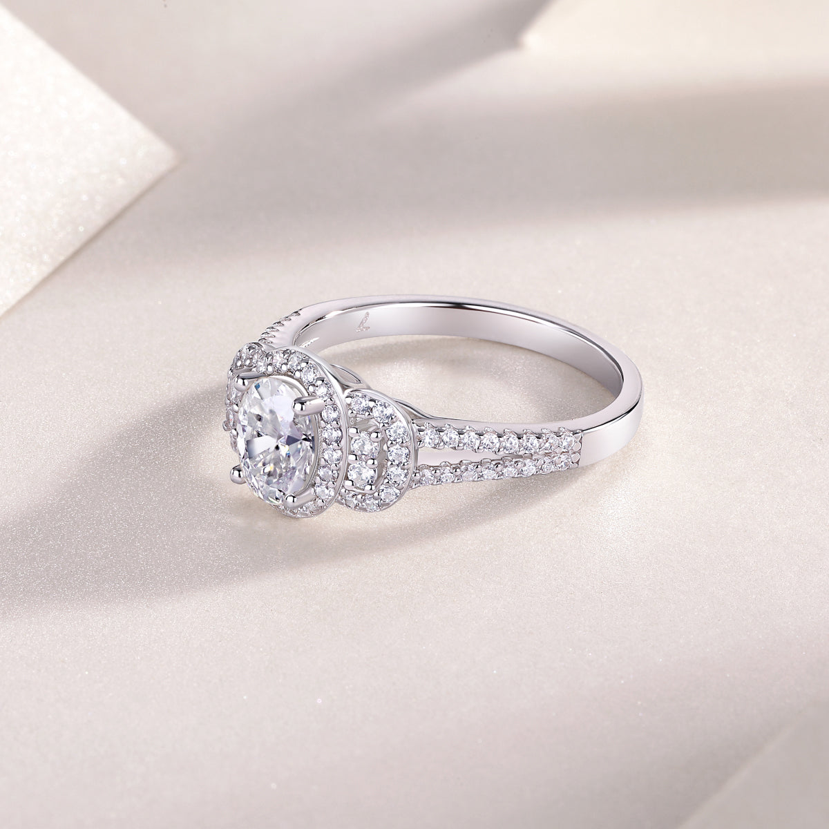 Oval halo moissanite ring with pavé band and split halo, white gold vermeil