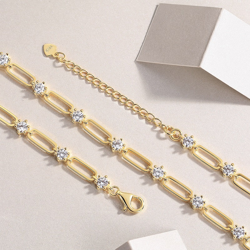 Moissanite station paperclip chain necklace detail with oval links and small round stones