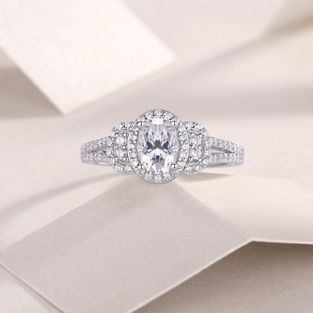 Oval halo moissanite ring with double pavé band in white gold vermeil