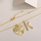 Heart charm and K initial moissanite on yellow-gold vermeil chain with clasp