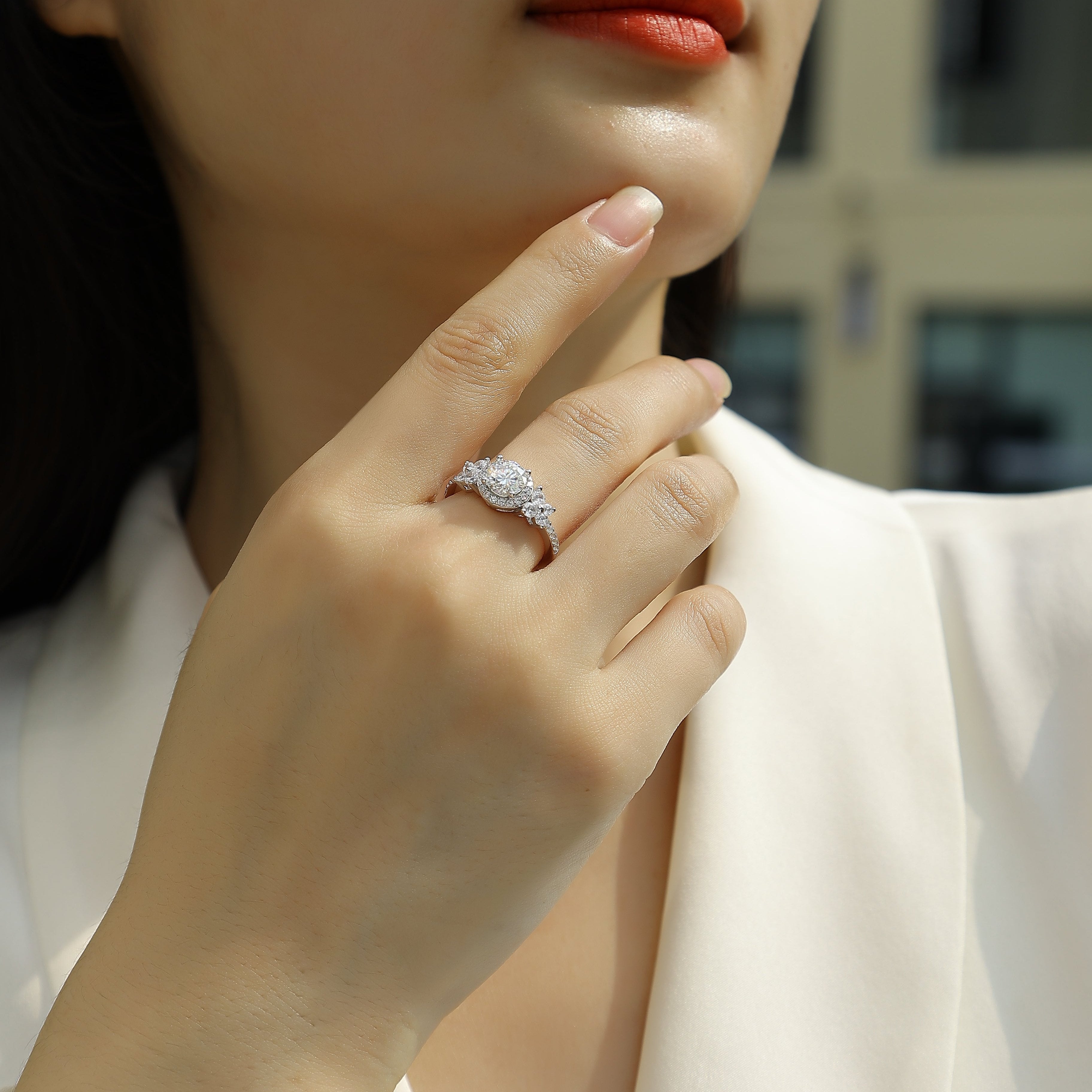 Round halo cluster ring on hand, pavé side stones in white gold vermeil