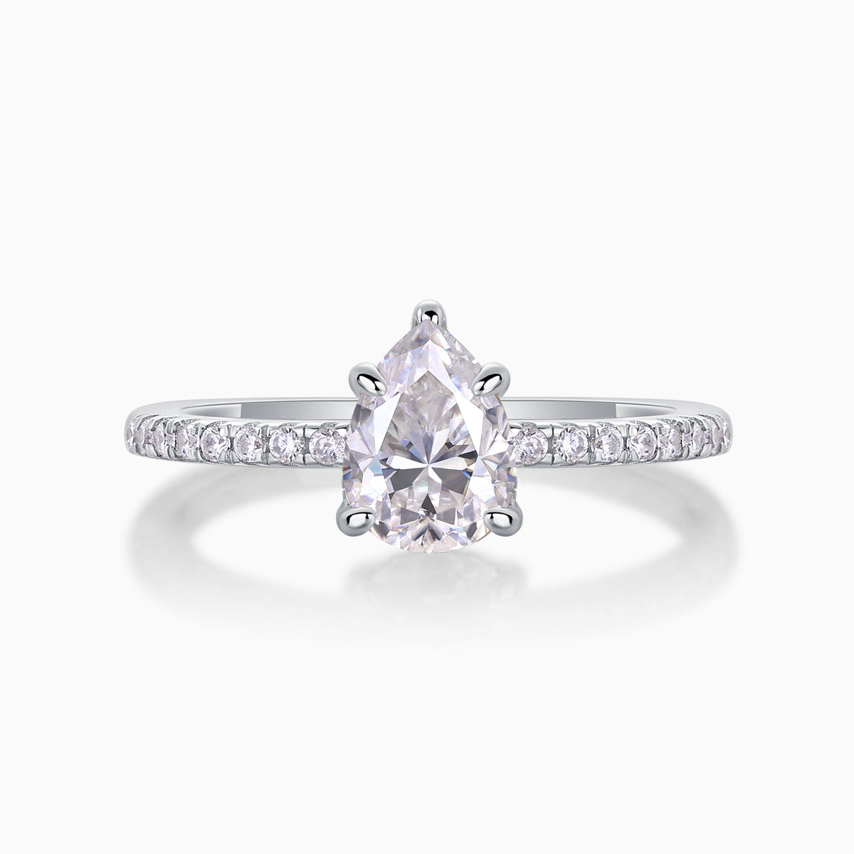 Pear cut moissanite engagement ring with pavé band and four-prong pear setting