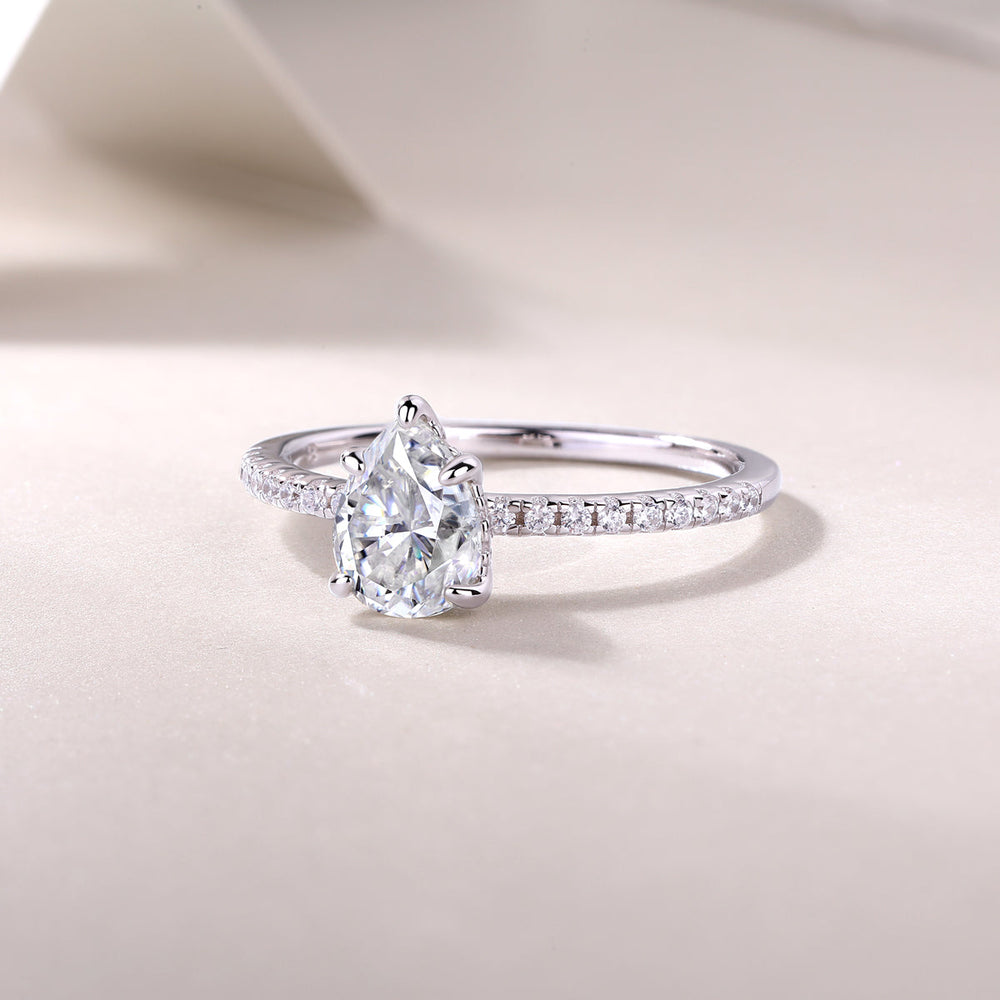 Pear cut pavé moissanite engagement ring, slender pavé band with pear center prongs