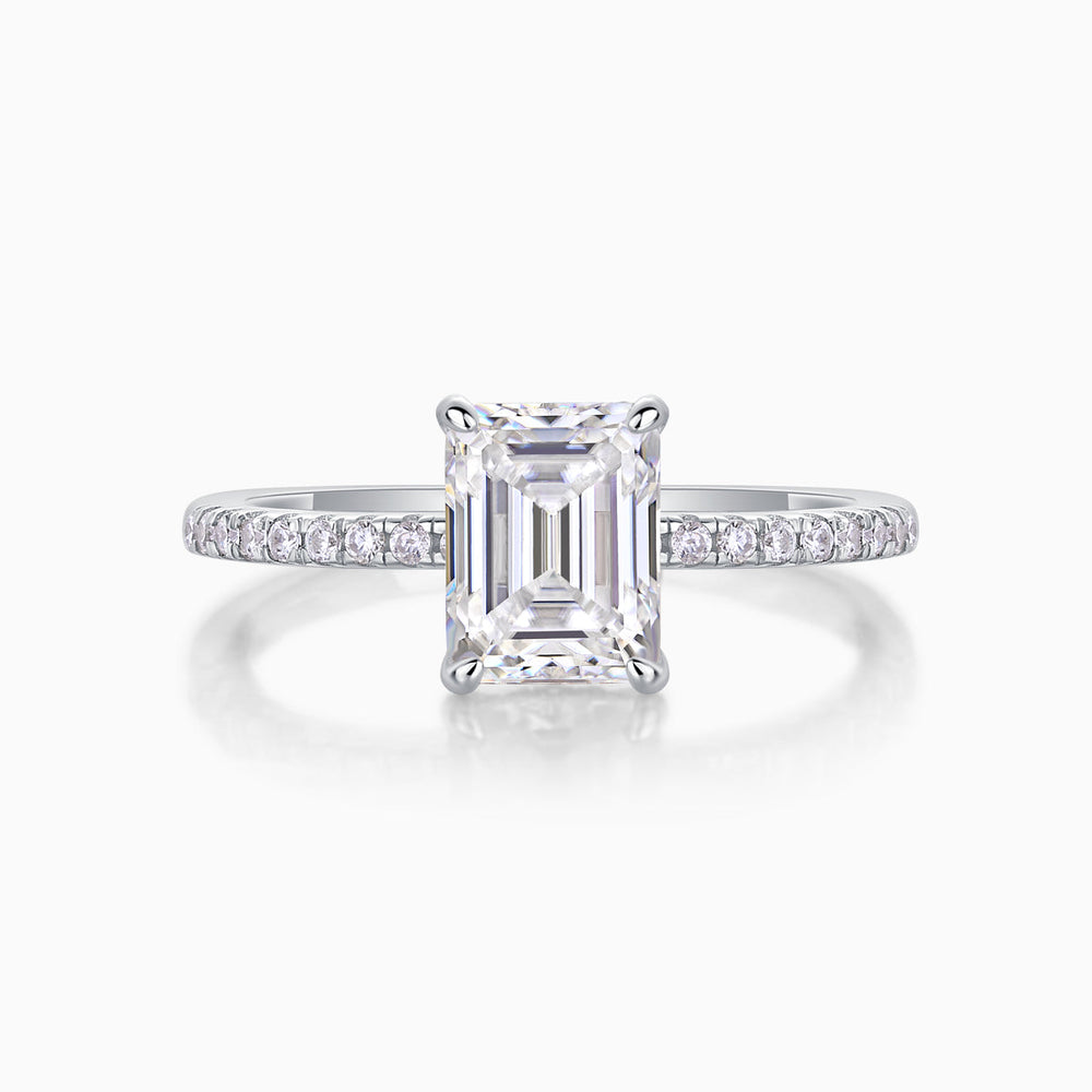 Emerald-cut center moissanite with pavé band, white gold vermeil, front view