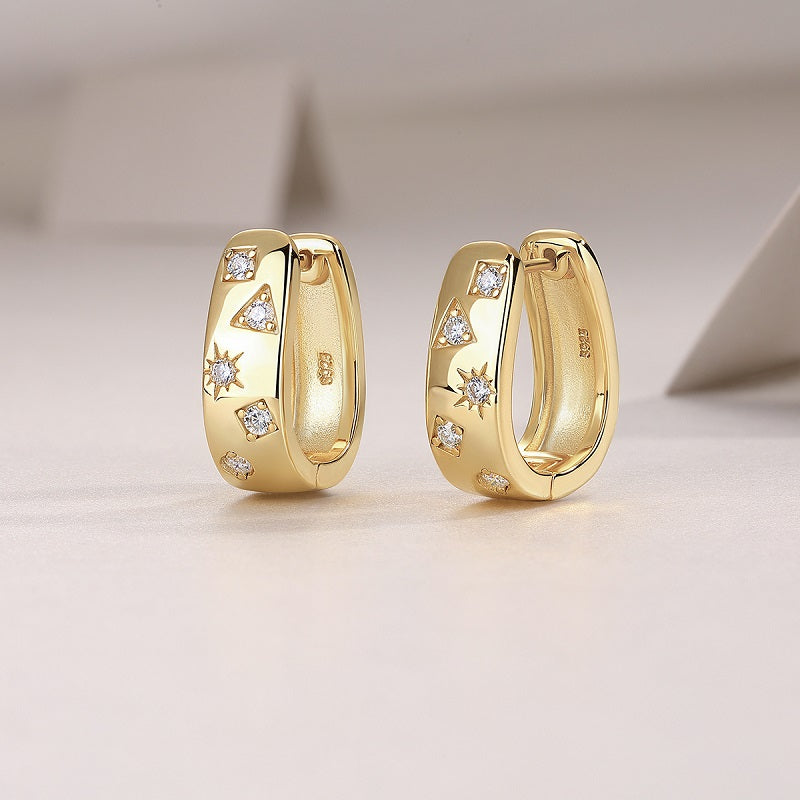 Side view of yellow gold vermeil huggie hoops with moissanite scatter stones