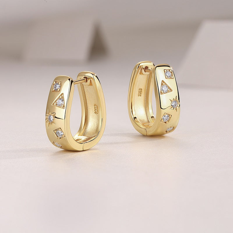 Yellow gold vermeil huggie hoops with moissanite scatter pattern, inner side visible