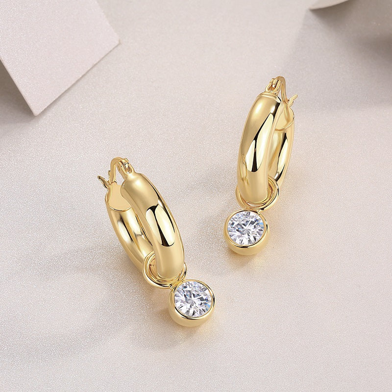 Chunky hoop earrings with bezel-set round moissanite drops, yellow gold vermeil