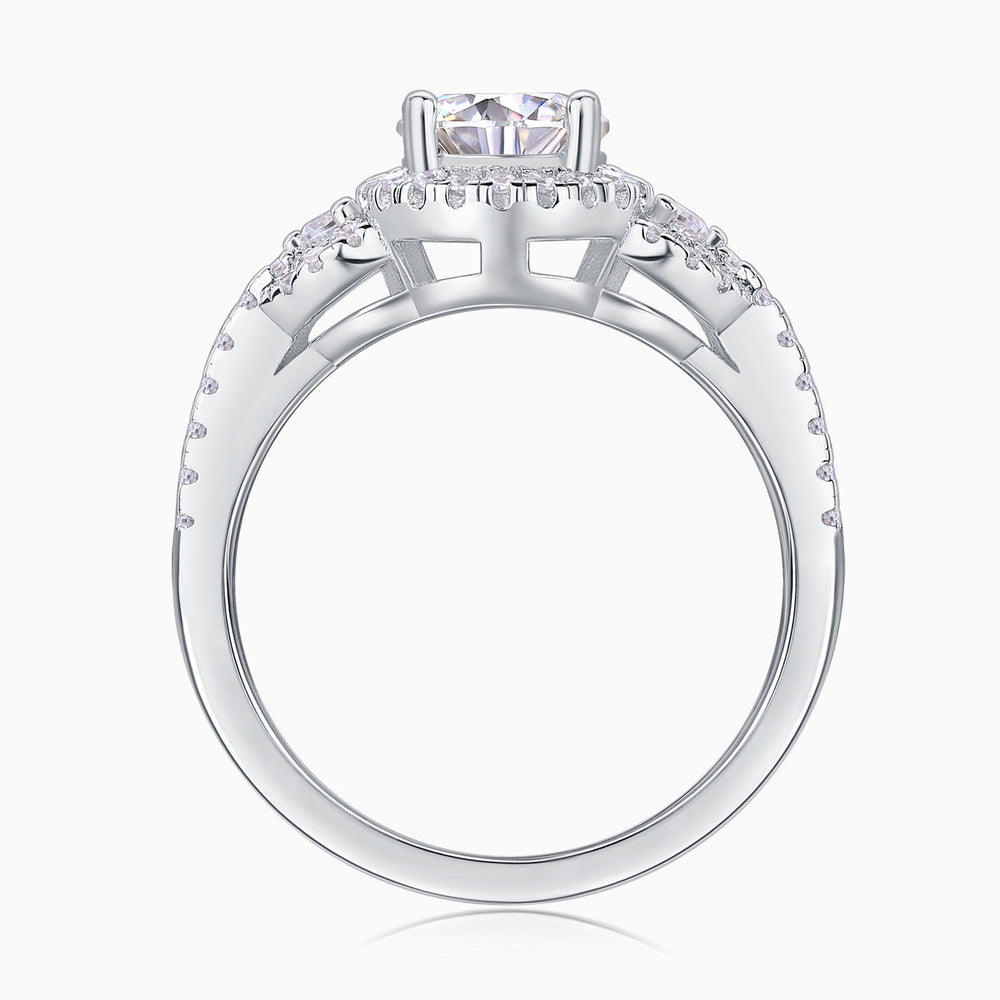Underside view: round halo ring with open band and prong-set center