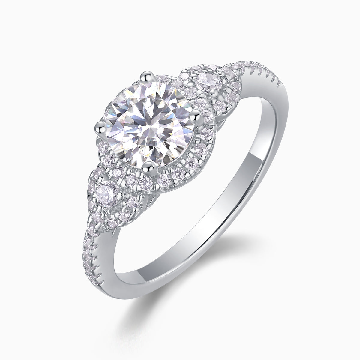 Moissanite halo ring with pear-shaped side stones and domed cluster setting