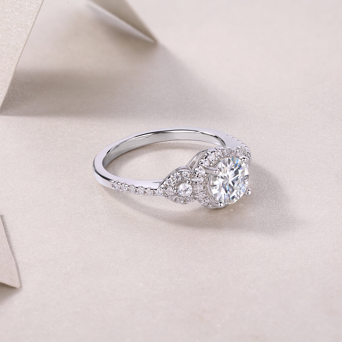 Round halo moissanite ring, side view with center stone and split shank