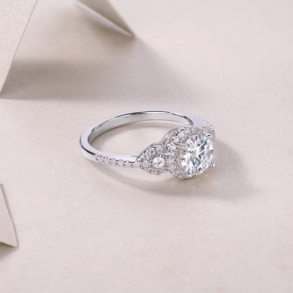 Round halo moissanite ring, side view with center stone and split shank