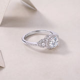 Round halo moissanite ring, side view with center stone and split shank