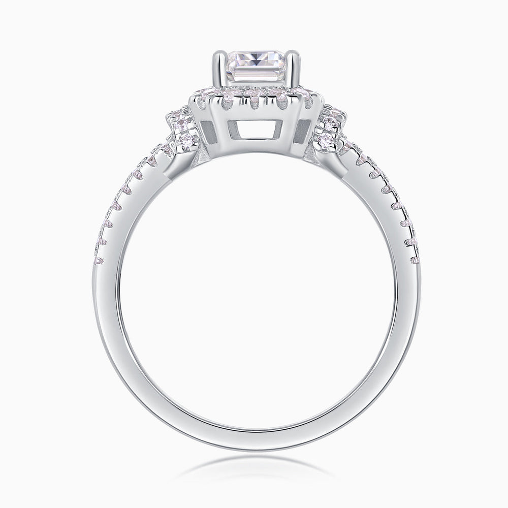 Band and prongs of emerald-cut halo moissanite ring with pavé detail