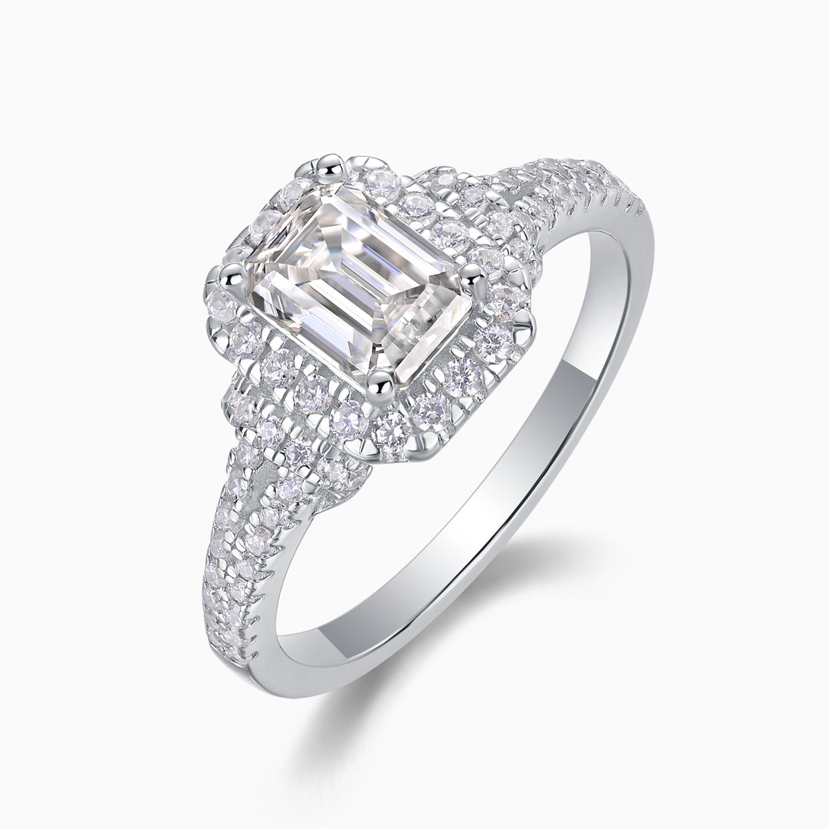 Angled view of emerald-cut halo moissanite ring with double pavé split shank