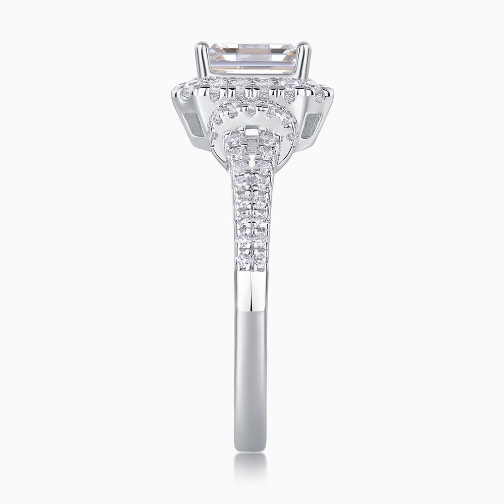 Top view of emerald-cut halo moissanite ring with pavé set details
