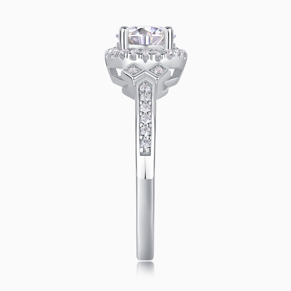 Close-up of round halo art deco cross pavé ring setting with prongs and side pavé
