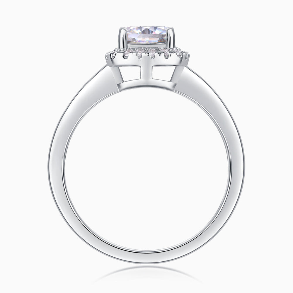 Top view: cushion cut moissanite center stone with halo prongs, white gold vermeil ring