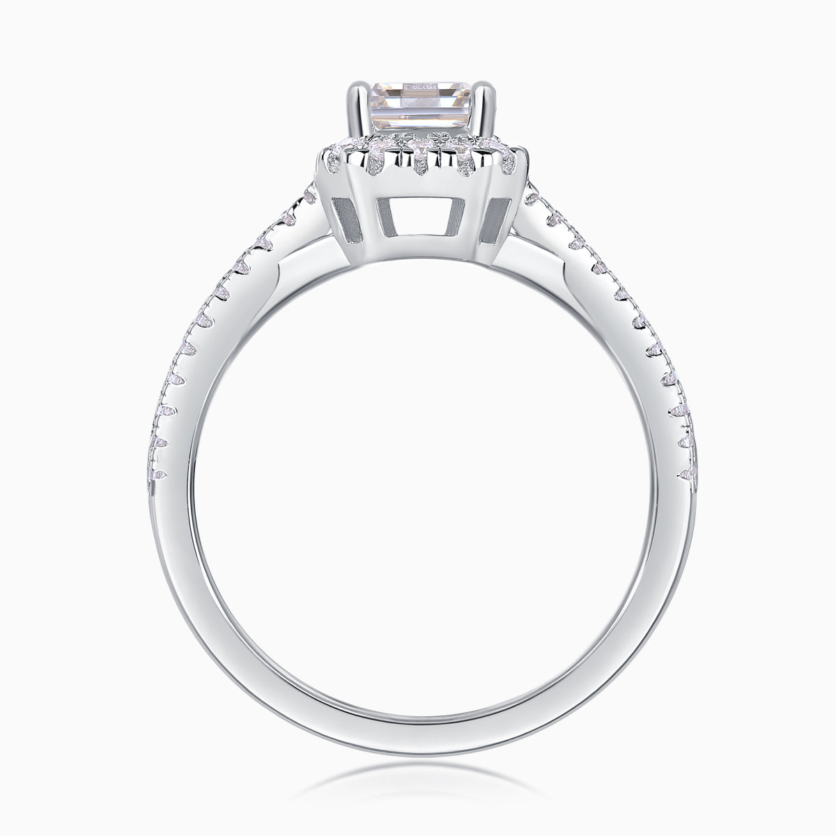 Underside view of emerald-cut halo ring with twisted pavé shank, white metal
