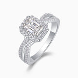 Emerald-cut halo moissanite ring with twisted pavé band, white metal