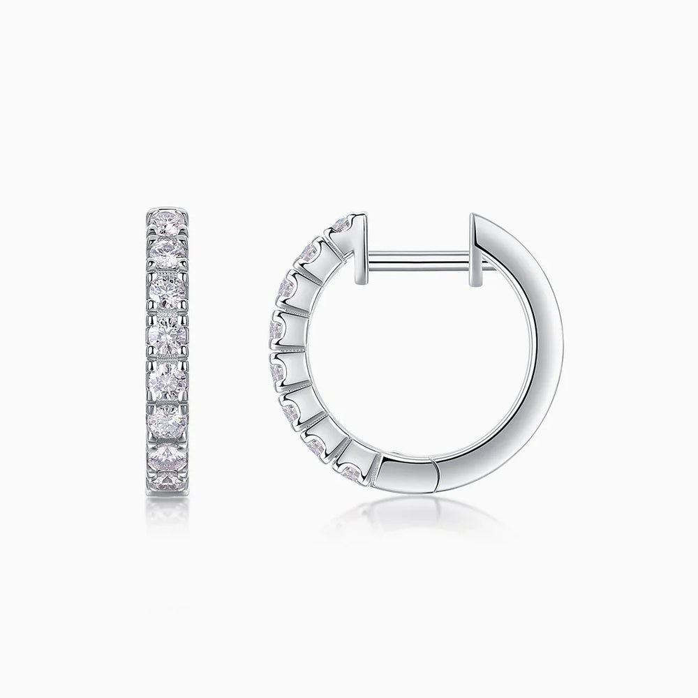 Moissanite huggie hoop earring, shared prong stone row with clasp open, white gold tone