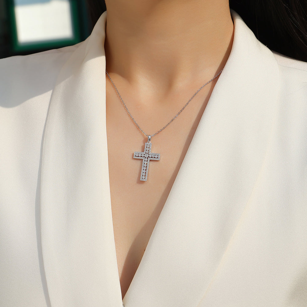 White gold vermeil pavé cross pendant on a chain, close view at neckline