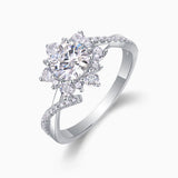 Side view of round halo moissanite engagement ring with pavé accents and twisted band