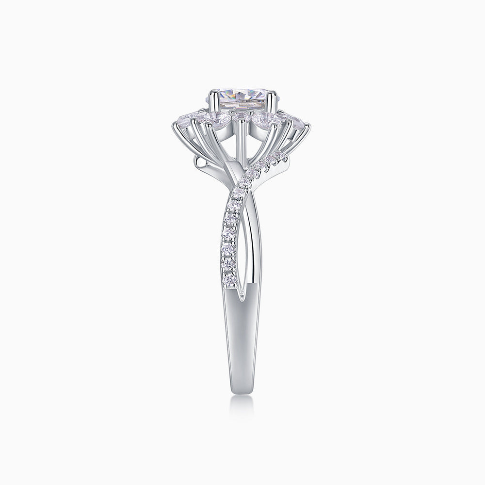 Angled view of halo moissanite engagement ring with rectangular center stone and pavé shank