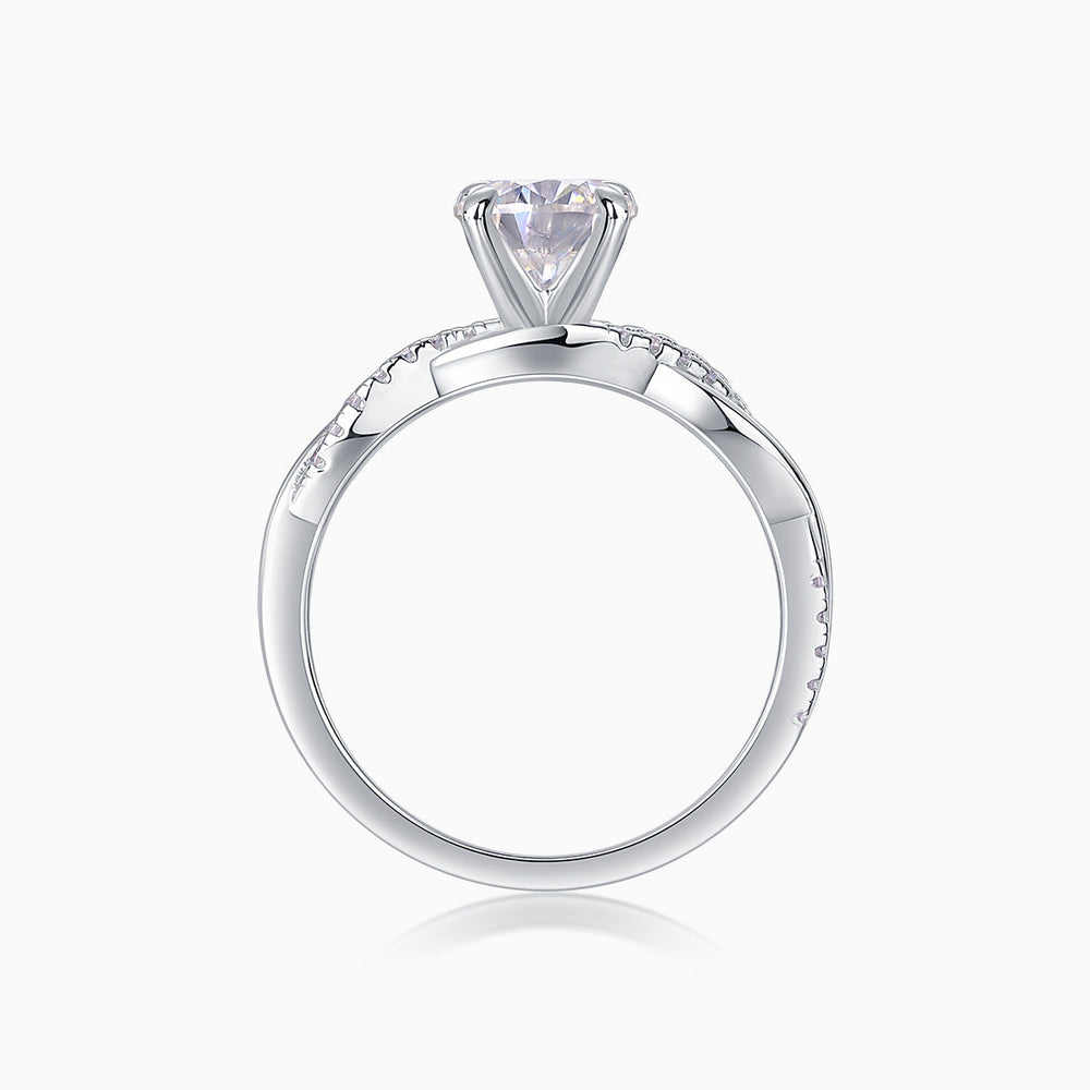 Round cut moissanite pavé ring, top view of round center stone and pavé detailing
