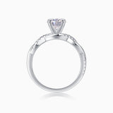 Round cut moissanite pavé ring, top view of round center stone and pavé detailing