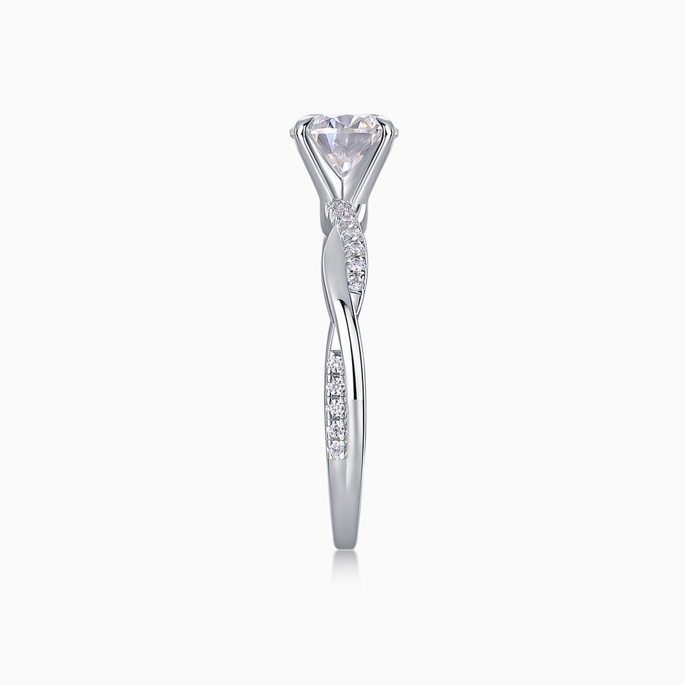 Round cut moissanite pavé wedding ring, side profile with round center stone and pavé band