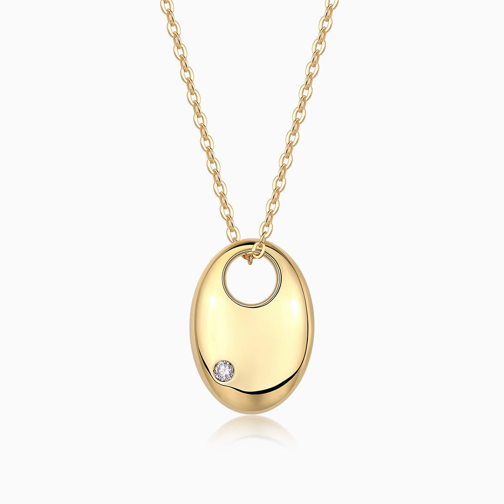 Oval dome pendant necklace with round moissanite accent; yellow gold vermeil chain