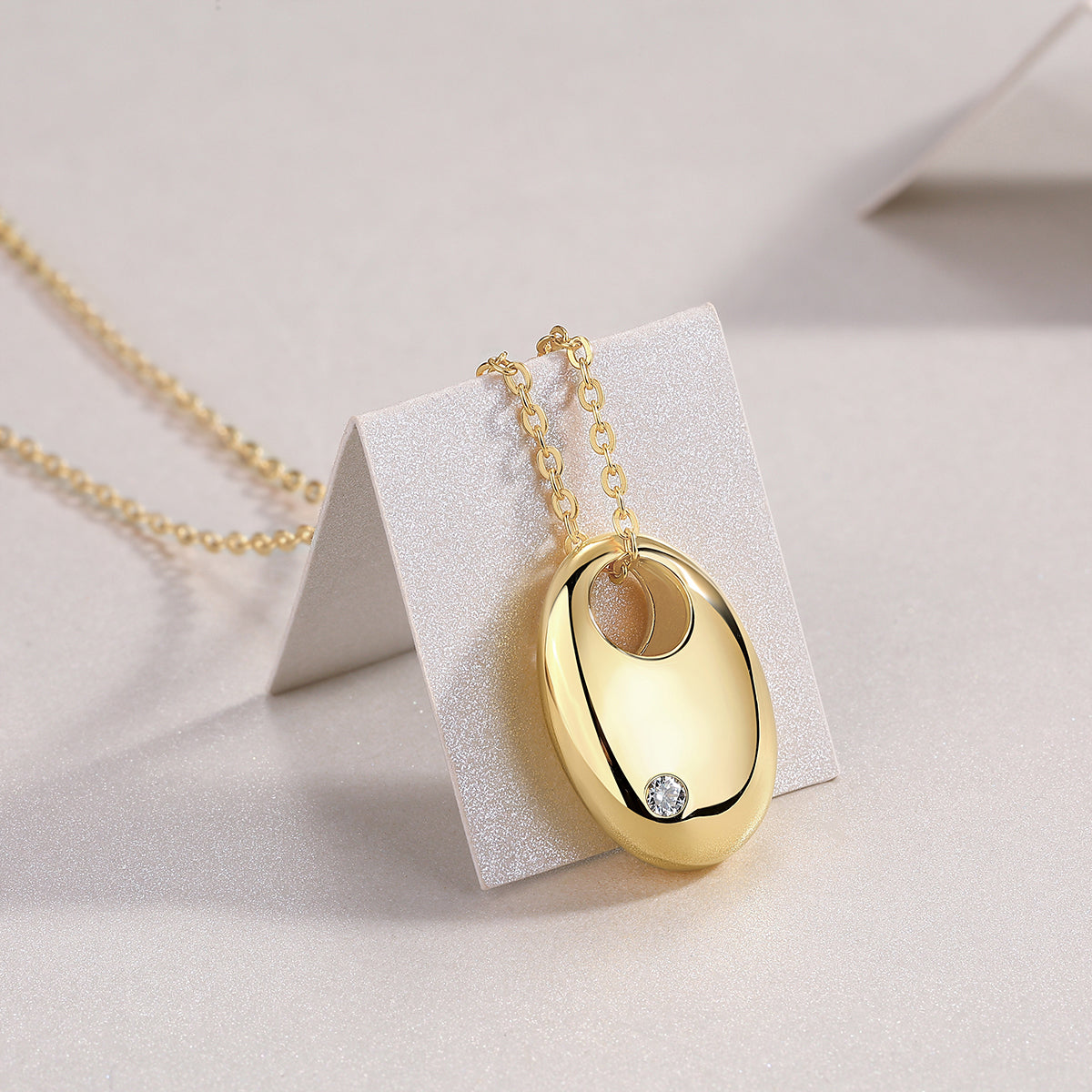 Oval dome moissanite pendant necklace on chain, yellow gold vermeil, with round stone