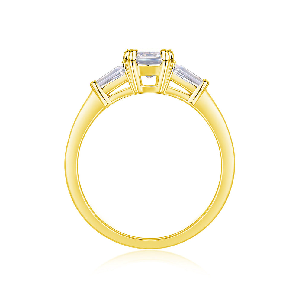 Yellow gold vermeil three-stone emerald-cut moissanite ring, top view of center setting