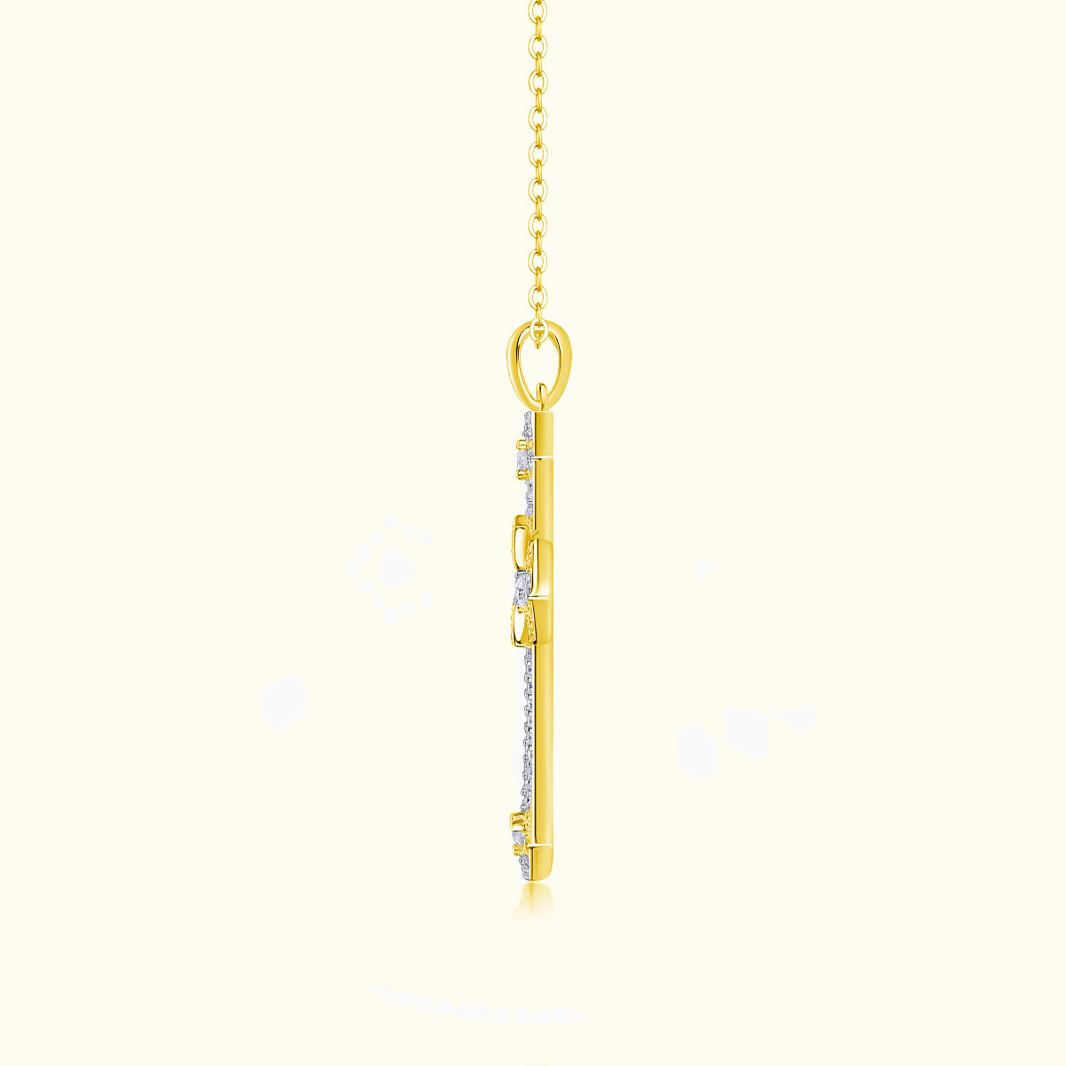 Yellow gold tone cross pendant back view with bail and chain links, pavé accents