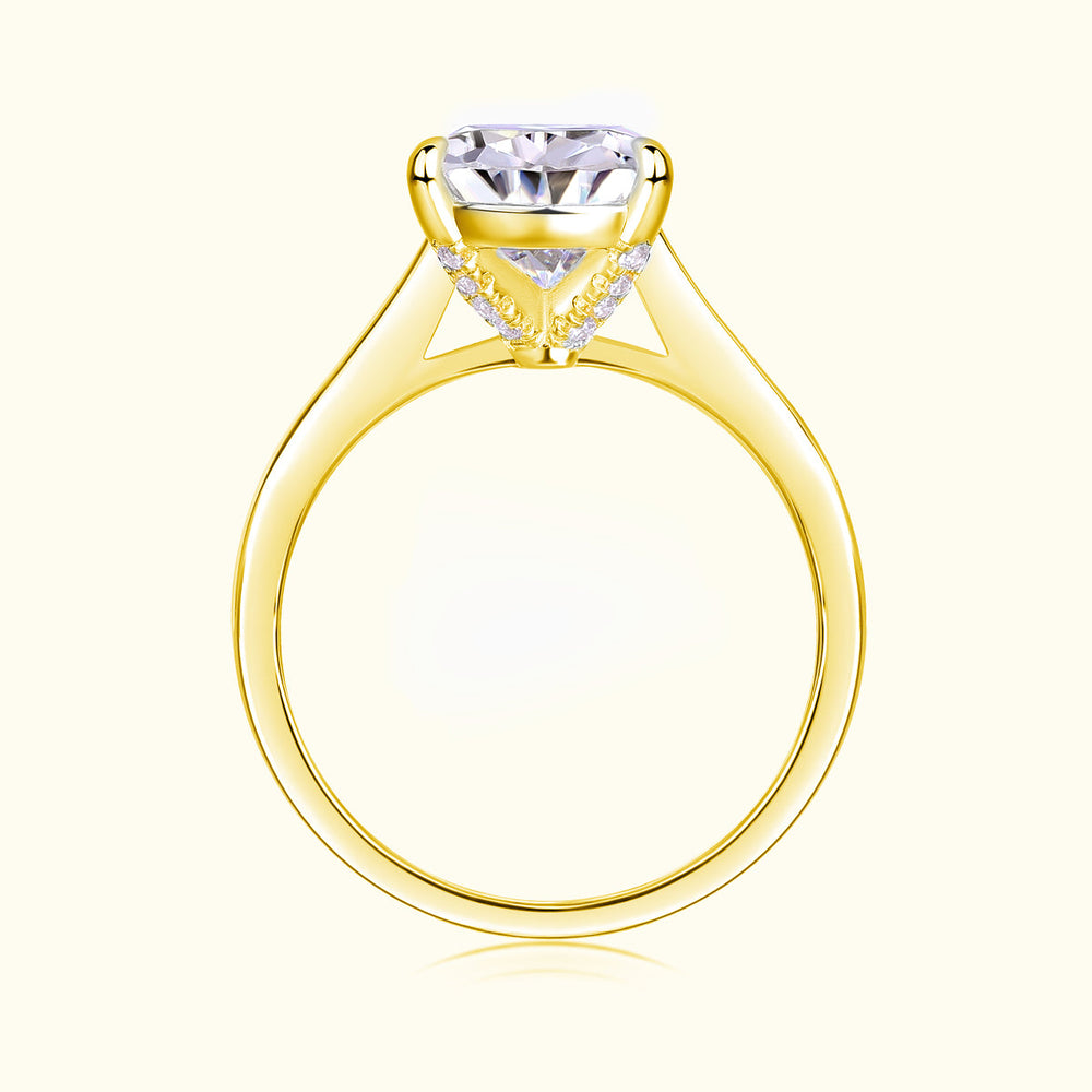 Yellow gold vermeil pear-cut solitaire moissanite ring, side view of setting details