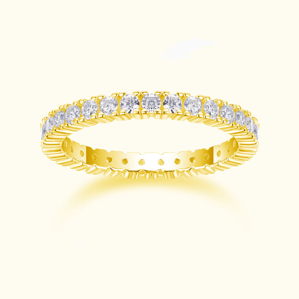 Minimalist moissanite pavé stacking ring in yellow gold tone with round stones across top